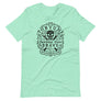 Light teal short sleeve t-shirt with centered skull and cross bones, with small additional artistic accents, surrounded in a circular pattern with "Fortune Favors the Brave". All lettering and imagining is in Black.