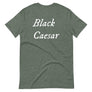 Grey unisex t-shirt with "Black Caesar" written in White, on two horizontal lines across the front. Black Caesar (died 1718) was a legendary 18th-century African pirate. The legends say that for nearly a decade, he raided shipping from the Florida Keys and later served as one of Captain Blackbeard's, a.k.a. Edward Teach's, crewmen aboard the Queen Anne's Revenge
