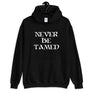 Black unisex hoodie depicting Mutineer Bay's trademarked slogan "Never Be Tamed" on three horizontal rows. All lettering is in White.