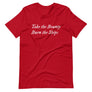 Red unisex t-shirt with wording "Take The Bounty, Burn the Ships" written on two horizontal rows in IM Fell font on the front. Lettering is in White.