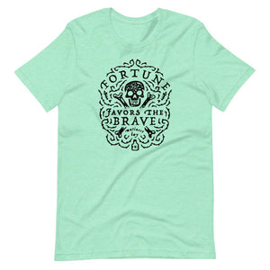 Light teal short sleeve t-shirt with centered skull and cross bones, with small additional artistic accents, surrounded in a circular pattern with "Fortune Favors the Brave". All lettering and imagining is in Black.