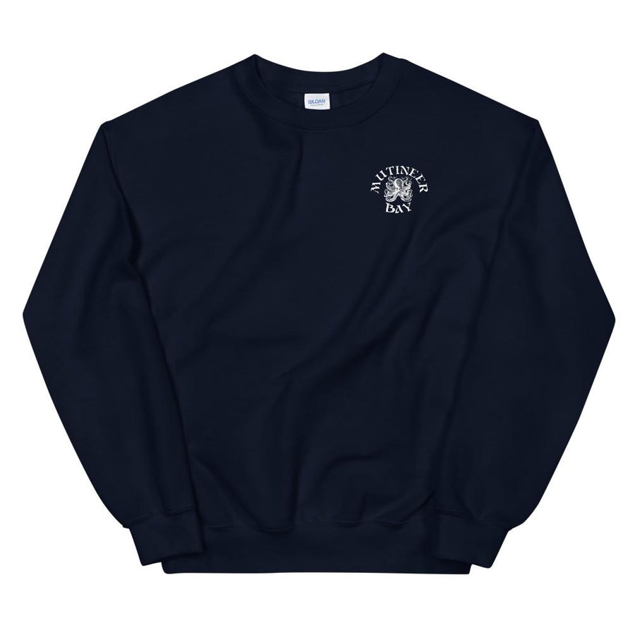 Navy Blue unisex sweatshirt wit white "Mutineer Bay" logo on front left breast. On the back is Mutineer Bay slogan "Never Be Tamed." written on three horizontal lines in white IM Fell font