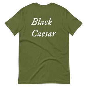 Mustard green unisex t-shirt with "Black Caesar" written in White, on two horizontal lines across the front. Black Caesar (died 1718) was a legendary 18th-century African pirate. The legends say that for nearly a decade, he raided shipping from the Florida Keys and later served as one of Captain Blackbeard's, a.k.a. Edward Teach's, crewmen aboard the Queen Anne's Revenge
