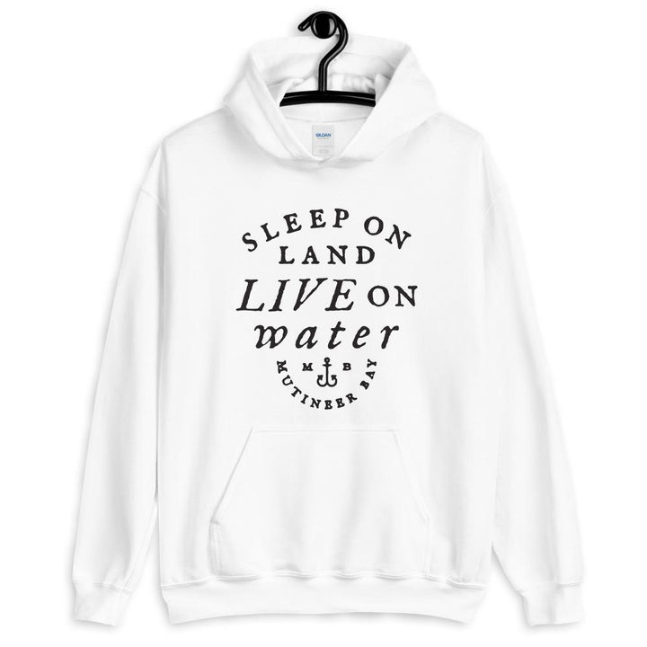 White unisex hoodie with wording "Sleep on Land, Live on Water" written in black artistic lettering on front. Underneath this is very small semi circle stating "Mutineer Bay" centered with small anchor.