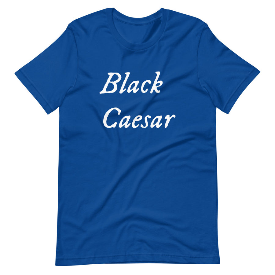 Royal blue unisex t-shirt with "Black Caesar" written in White, on two horizontal lines across the front. Black Caesar (died 1718) was a legendary 18th-century African pirate. The legends say that for nearly a decade, he raided shipping from the Florida Keys and later served as one of Captain Blackbeard's, a.k.a. Edward Teach's, crewmen aboard the Queen Anne's Revenge