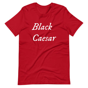 Redunisex t-shirt with "Black Caesar" written in White, on two horizontal lines across the front. Black Caesar (died 1718) was a legendary 18th-century African pirate. The legends say that for nearly a decade, he raided shipping from the Florida Keys and later served as one of Captain Blackbeard's, a.k.a. Edward Teach's, crewmen aboard the Queen Anne's Revenge