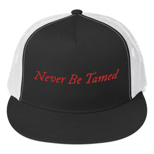 Stylish trucker cap with the phrase "Never Be Tamed" written horizontally in IM Fell font on the front of cap. Cap brim is black, front of cap is black, sides of cap are white. All lettering is in Red.