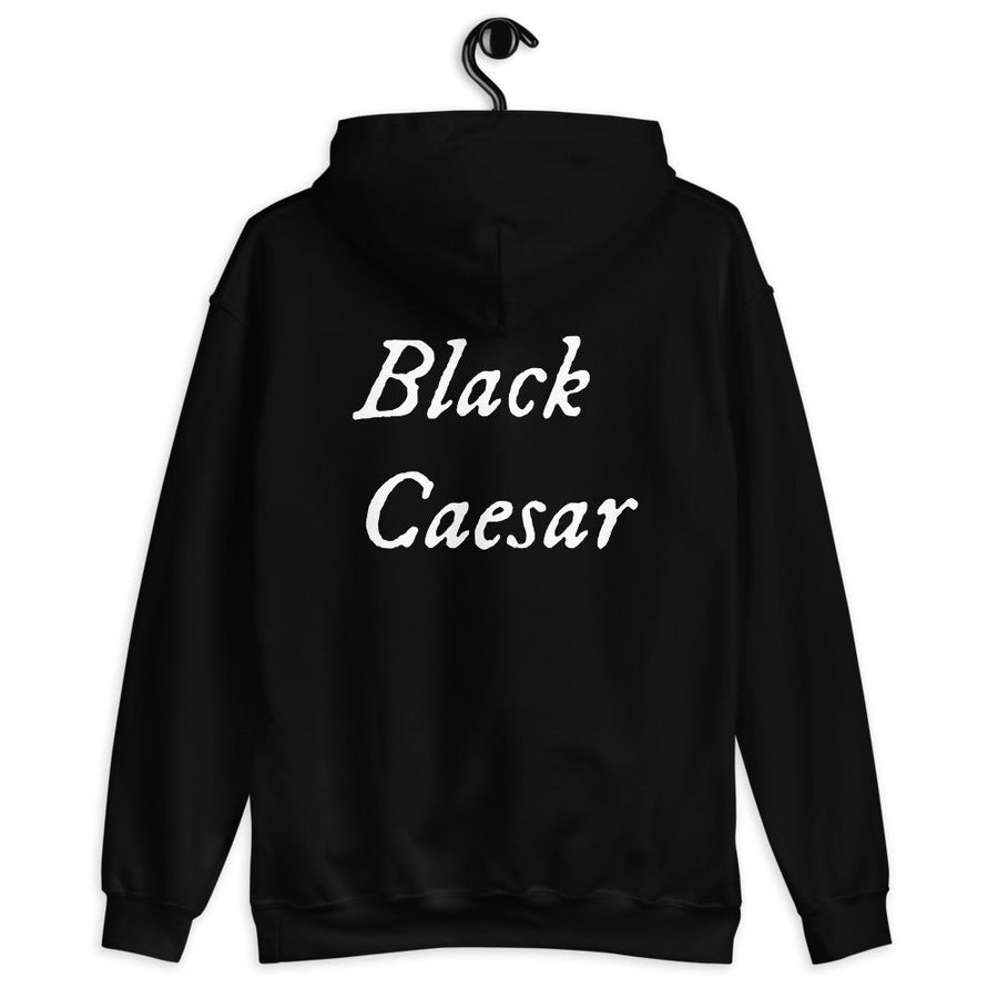 Black unisex hoodie with "Black Caesar" written horizontally, on two lines, on the front and back in white lettering. Black Caesar (died 1718) was a legendary 18th-century African pirate. The legends say that for nearly a decade, he raided shipping from the Florida Keys and later served as one of Captain Blackbeard's, a.k.a. Edward Teach's, crewmen aboard the Queen Anne's Revenge