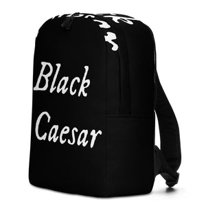 All over printed black backpack with "Black Caesar" written in White IM Fell font, in two horizontal lines across the back. Black Caesar (died 1718) was a legendary 18th-century African pirate. The legends say that for nearly a decade, he raided shipping from the Florida Keys and later served as one of Captain Blackbeard's, a.k.a. Edward Teach's, crewmen aboard the Queen Anne's Revenge