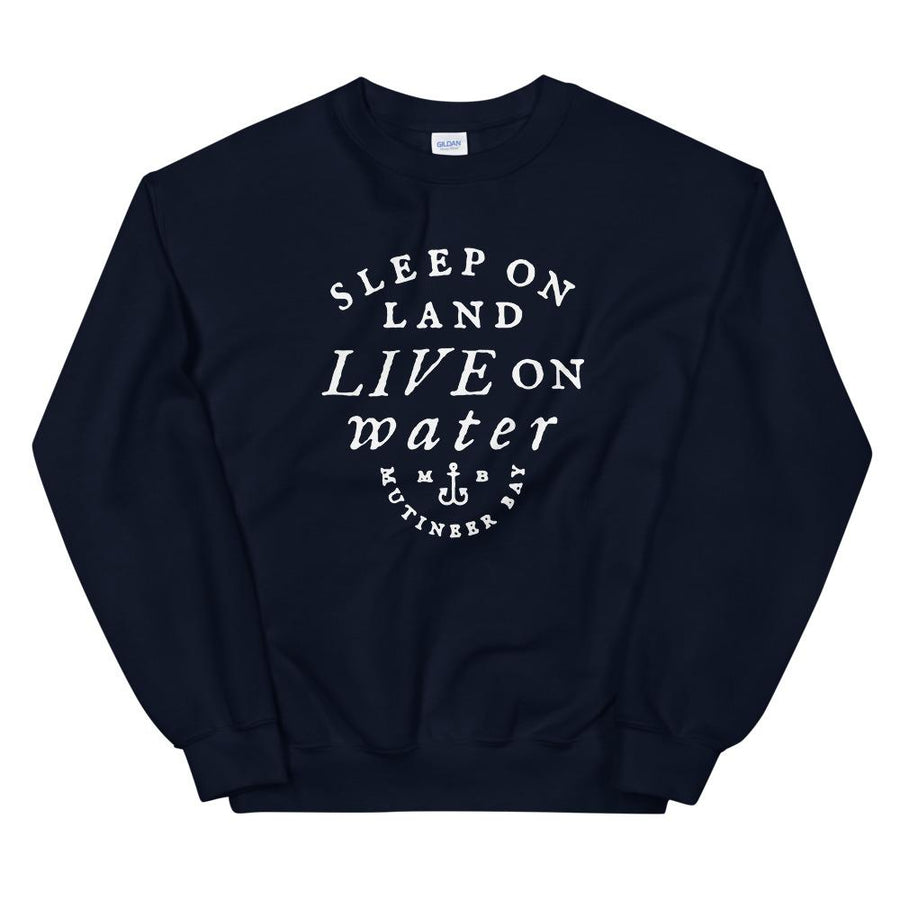 Charcoal Black unisex sweatshirt with wording in white, "Sleep on Land, Live on Water" written in black artistic lettering on front. Underneath this is very small semi circle stating "Mutineer Bay" centered with small anchor. All lettering and images are in white.