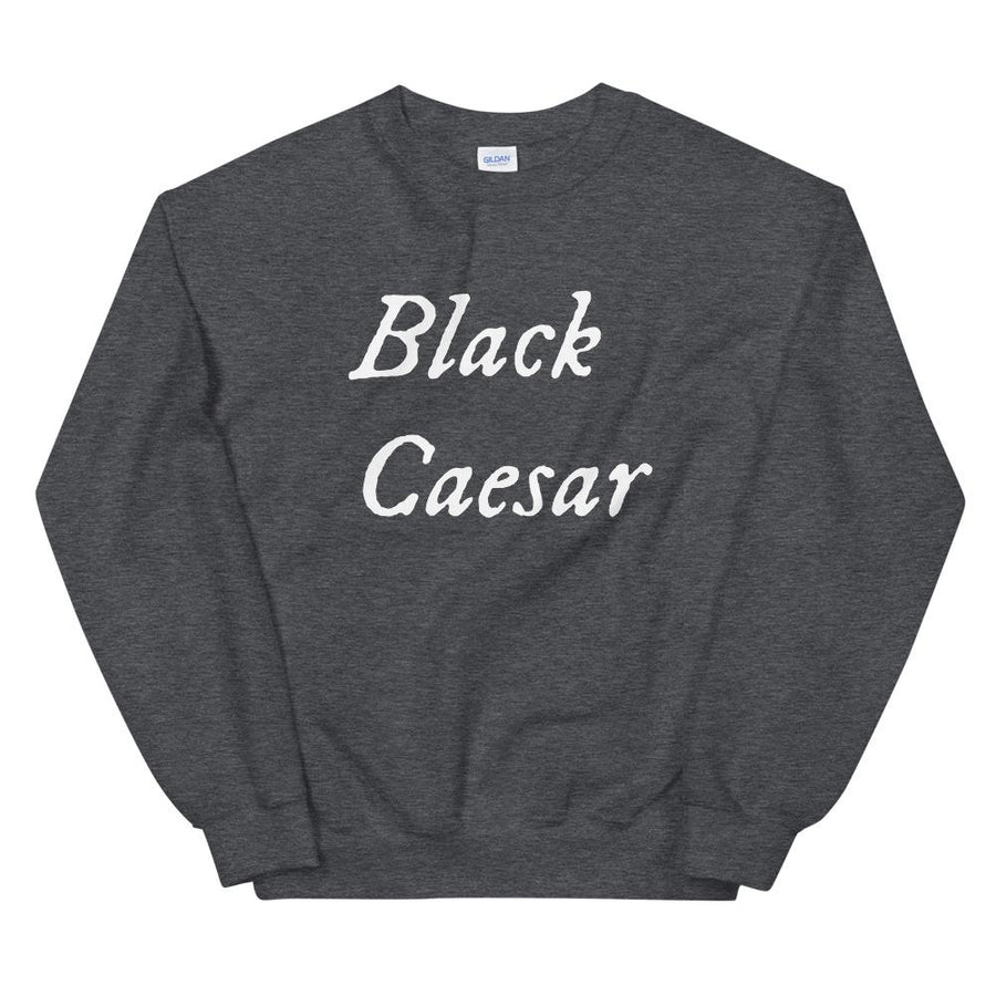 Grey sweatshirt with "Black Caesar" written in White, on two horizontal lines across the front. Black Caesar (died 1718) was a legendary 18th-century African pirate. The legends say that for nearly a decade, he raided shipping from the Florida Keys and later served as one of Captain Blackbeard's, a.k.a. Edward Teach's, crewmen aboard the Queen Anne's Revenge