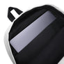White minimalist backpack depicting black pirate flag of Emanuel Wynn, famous French pirate, which is a variant of crossbones motif with an addition of an hourglass which represented that pirate prey's time is up.