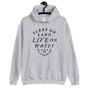 Grey unisex hoodie with wording "Sleep on Land, Live on Water" written in black artistic lettering on front. Underneath this is very small semi circle stating "Mutineer Bay" centered with small anchor.