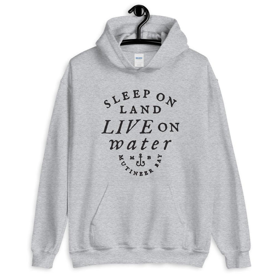 Grey unisex hoodie with wording "Sleep on Land, Live on Water" written in black artistic lettering on front. Underneath this is very small semi circle stating "Mutineer Bay" centered with small anchor.